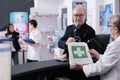 Man checking medications order in bag at counter desk Royalty Free Stock Photo