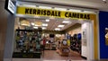 Man checking new camera at Kerrisdale cameras store