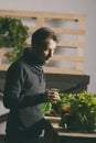 Man is checking and taking care of plants Royalty Free Stock Photo