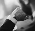 Man checking the time on his wrist watch Royalty Free Stock Photo