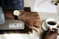 Man checking time from watch in hotel room Royalty Free Stock Photo