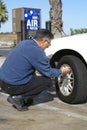 Man Checking Tire Pressure Royalty Free Stock Photo