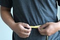 Man Checking Waistline body shape waist measure tape Royalty Free Stock Photo
