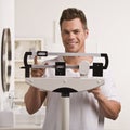 Man Checking Weight Royalty Free Stock Photo