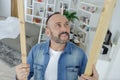 Man checking wood at home