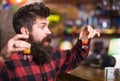 Man with cheerful face sit alone at bar counter. Royalty Free Stock Photo