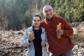 Man and cheerful woman eating sandwitches at picnic outdoors Royalty Free Stock Photo