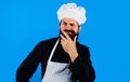 Man chef, cook or baker in uniform thinks what to cook. Cooking, profession and inspiration concept.