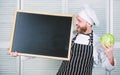 Man chef hat apron hold blackboard copy space. Recipe concept. Cooking delicious meal step by step. Menu for today. List