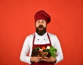 Man chef holding basket with organic vegetables Royalty Free Stock Photo