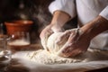 Man chef kneading dough in day sunlight Royalty Free Stock Photo