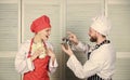 Man chef offer dessert or meal under cloche to girl. Will you eat my meal. Culinary family. Woman and bearded man