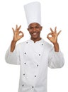 Man, chef and portrait with okay sign, culinary expert and confident guy on white studio background. African person