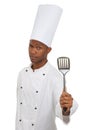 Man, chef and portrait with spatula tool in studio isolated on white background. Face, professional cook and kitchen Royalty Free Stock Photo