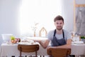 Man chef smiling looking camera with holding tray empty