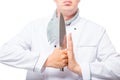 man in chef uniform with a sharp knife in his hands on a white Royalty Free Stock Photo