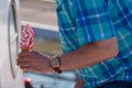 Man in chequed shirt buys rapsberry ice cream Royalty Free Stock Photo