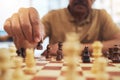 Man, chess board game and hands on pawn for fun strategy, hobby and decision in challenge. Closeup, chessboard or player