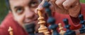 Man in chess game moves a piece, hand close up Royalty Free Stock Photo