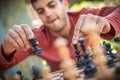 Man in chess game moves a piece, hand close up Royalty Free Stock Photo