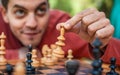 Man in chess game moves a piece, hand close up Royalty Free Stock Photo