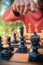 Man in chess game moves a piece, hand close up Royalty Free Stock Photo