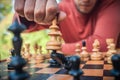 Man in chess game moves a piece, hand close up Royalty Free Stock Photo