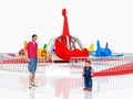 Man, child and amusement park ride against a white background Royalty Free Stock Photo