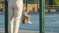 Man and child on the basketball court