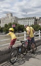 Man and child with bicycles Waterloo Bridge London UK