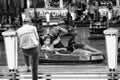 Man and child take a break from driving a dodgem car at the fair. Velez Malaga, Spain.