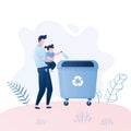 Man with a child throw garbage in the trash can.Recycling concept Royalty Free Stock Photo