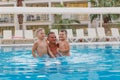 A man with children having fun in the outdoor pool Royalty Free Stock Photo