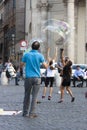 Man and children with large soap bubbles Royalty Free Stock Photo