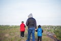 A man and children are standing on a rock and watching what is happening below. panoramic view from above. Russia, Rostov region, Royalty Free Stock Photo