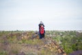 A man and children are standing on a rock and watching what is happening below. panoramic view from above. Russia, Rostov region, Royalty Free Stock Photo