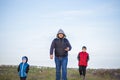 A man and children are standing on a rock and watching what is happening below. panoramic view from above. Russia, Rostov region, Royalty Free Stock Photo