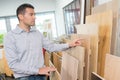 man chooses boards for home improvement