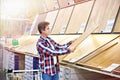 Man chooses floorboard for home renovation Royalty Free Stock Photo