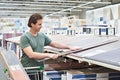 Man chooses floorboard laminate in store Royalty Free Stock Photo