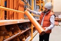 man chooses sewer pipes in a hardware store Royalty Free Stock Photo