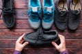 Man chooses shoes holding black loafers Royalty Free Stock Photo