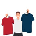 Man choosing clothes near wardrobe at home. Guy feel confused make decision about garment or apparel. Fashion and style problem