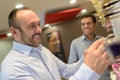 man choosing glasses in optics store Royalty Free Stock Photo
