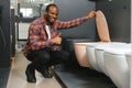 African american Man choosing home toilet in store Royalty Free Stock Photo