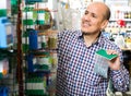 Man choosing nails and screws Royalty Free Stock Photo