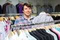 Man choosing shirts in store Royalty Free Stock Photo