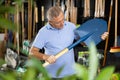 Man choosing shovel in store Royalty Free Stock Photo