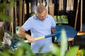 Man choosing shovel in store Royalty Free Stock Photo