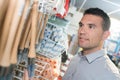 man choosing tools in household shop Royalty Free Stock Photo